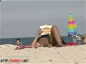 molten honeys filmed lying on a nudist beach